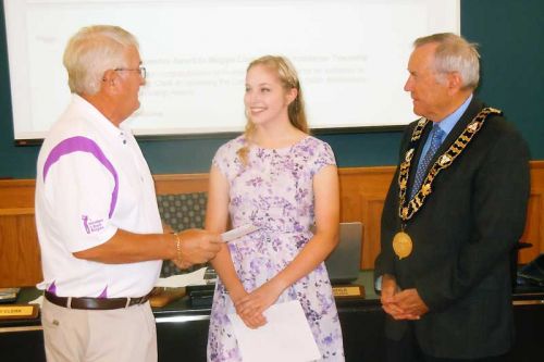 Gary Davison and Dennis Doyle present Maggie Clark with the one-time 150th anniversary scholarship award on behalf of the County of Frontenac on July 15